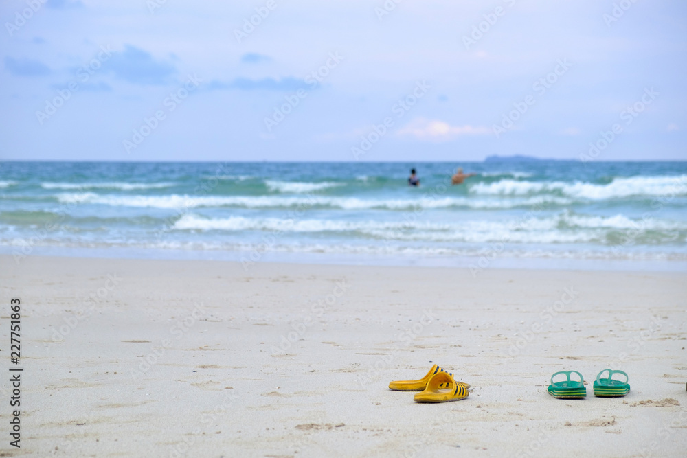 shoes on sea beach,holdiay concept. shoes on sea beach,holdiay concept.