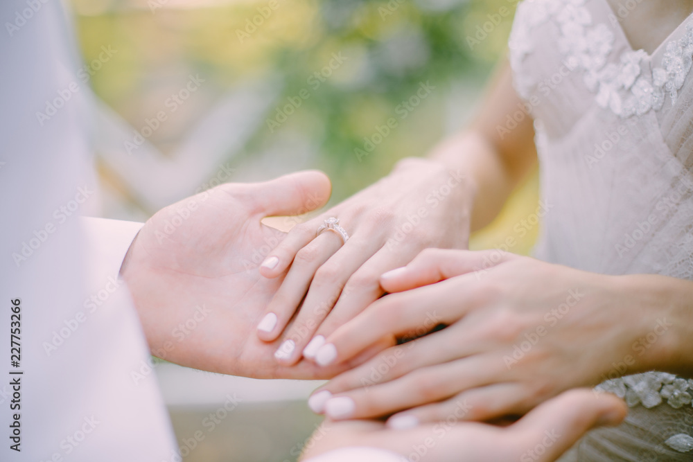 bride and groom holding hands in the park bride and groom holding hands in the park