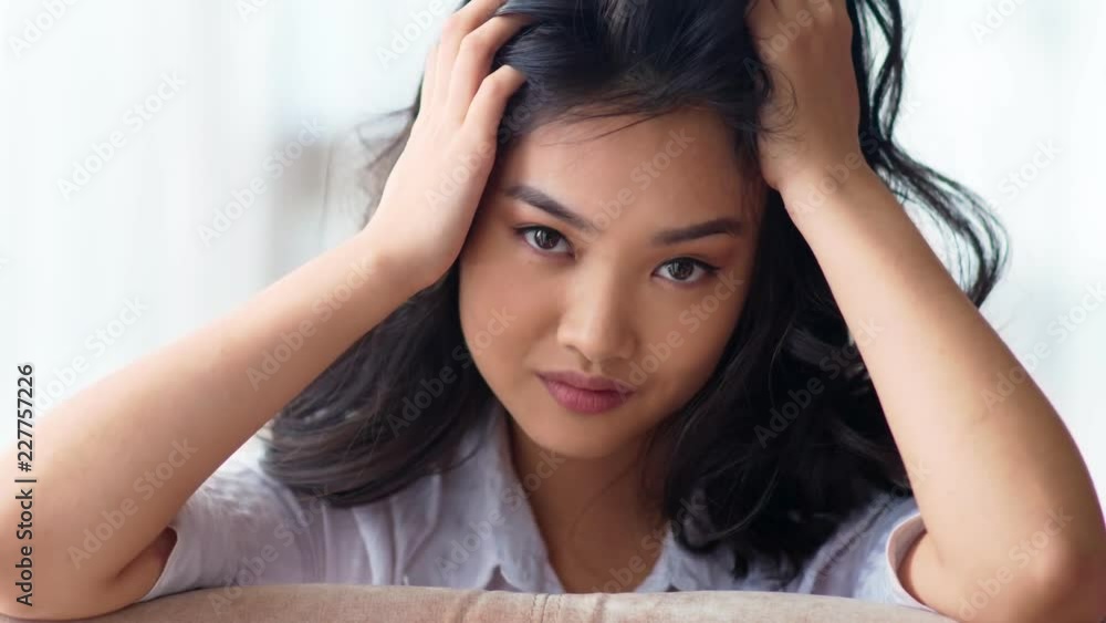 Beautiful Asian young female fashion model flirting and posing for fotoshooting close-up portrait Beautiful Asian young female fashion model flirting and posing for fotoshooting close-up portrait