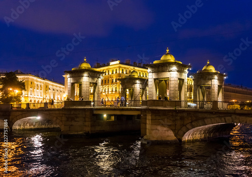 Brightly lit Lomonosov bridge at night in St. Petersburg. Russia photo