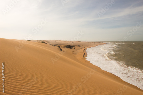 Sand dunes and the ocean in northeastern part of Colombia, cabo de la vela, la guajira, punta gallinas