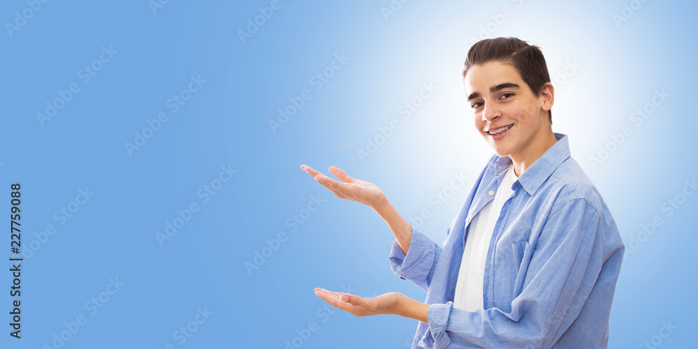 portrait of young with braces isolated in white pointing portrait of young with braces isolated in white pointing
