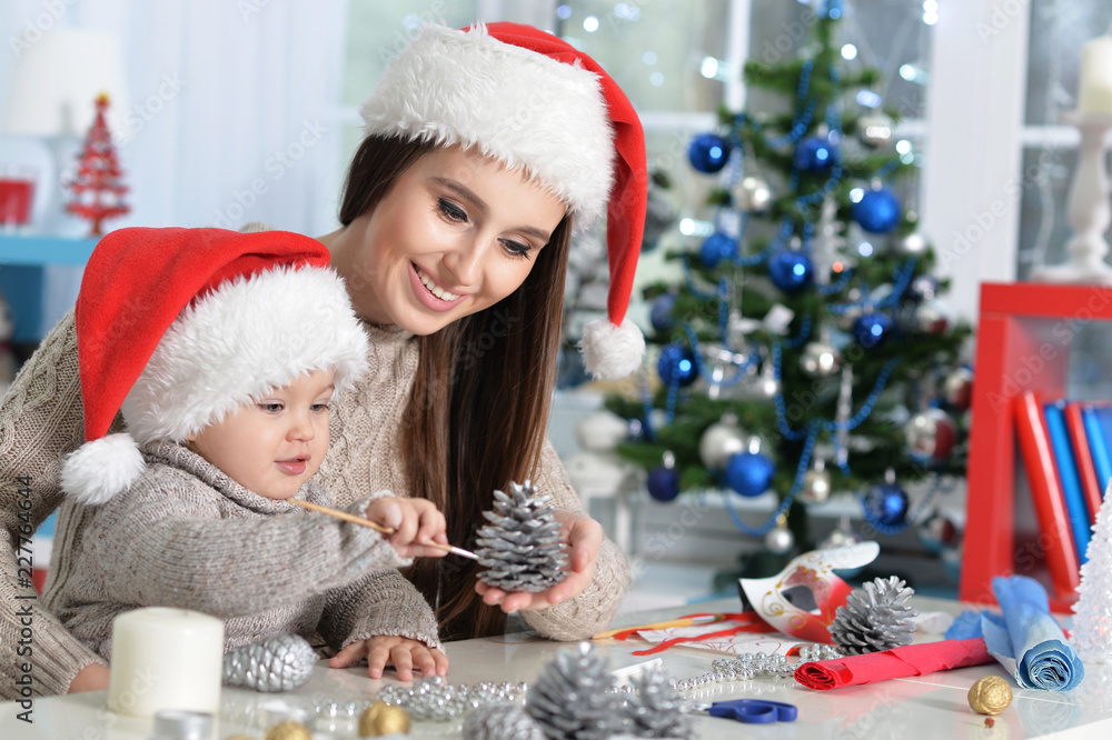 Portrait of a mother and daughter preparing for Christmas Portrait of a mother and daughter preparing for Christmas