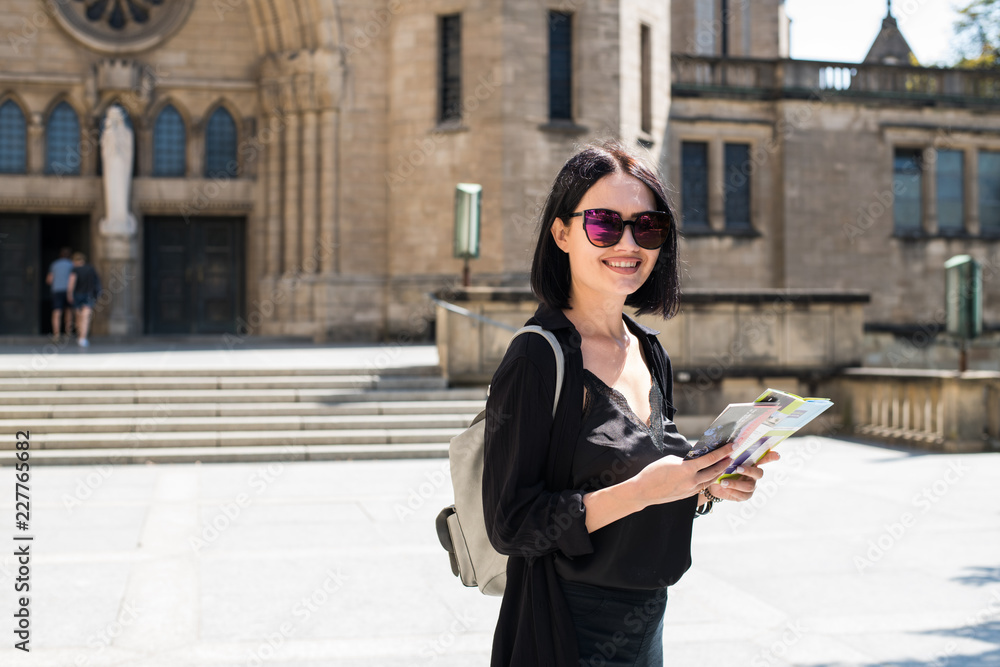 Travel guide, tourism in Europe, woman tourist with map on the street. Travel guide, tourism in Europe, woman tourist with map on the street.