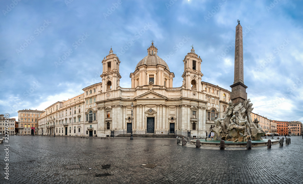 Panorama of Piazza Navona square with Fontana dei Fiumi fountain and Sant'Agnese in Agone church, Rome, Italy