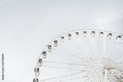 Ferris wheel on sky background.