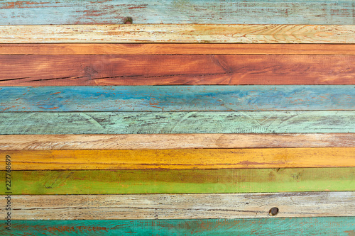 Old multicolored wooden background. Colorful wooden planks texture backdrop. Creative colorful wallpaper.