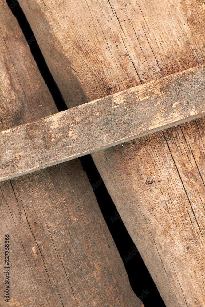 Fototapeta premium Old rustic boards background. Vintage wooden planks with cracks close up.
