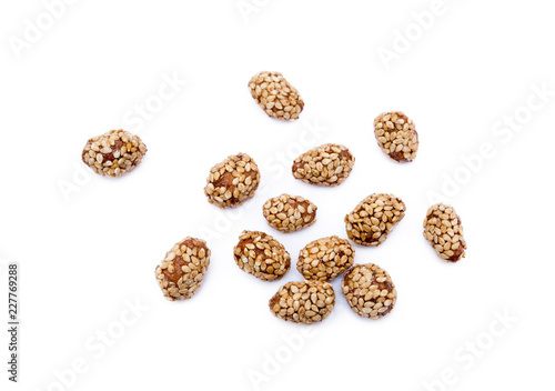 Coated peanuts with sesame isolated on white background