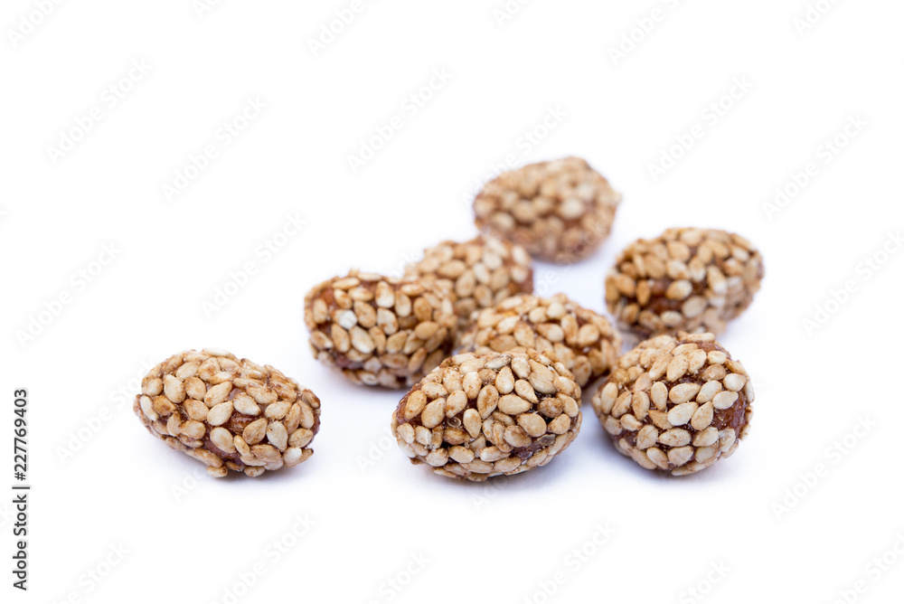 Coated peanuts with sesame isolated on white background Coated peanuts with sesame isolated on white background