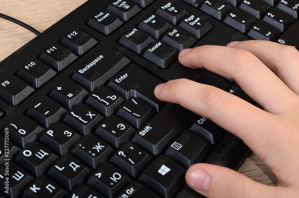 Women's hands typing on a the keyboard Women's hands typing on a the keyboard