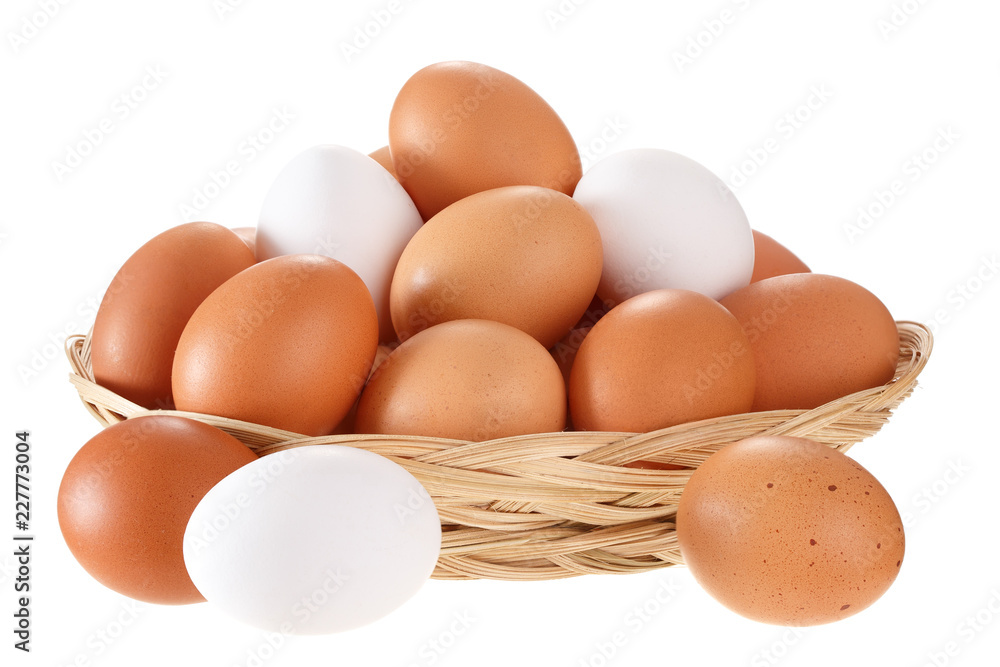 Eggs in a wicker basket. Isolated on white background.