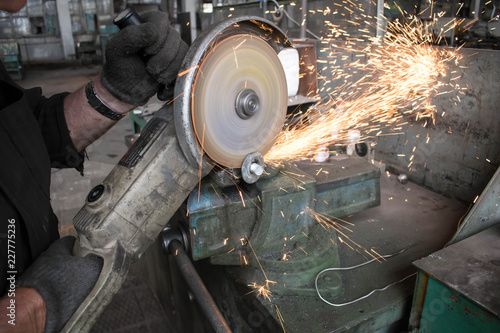 turning works threading on the factory machine spark from the grinding wheel for design