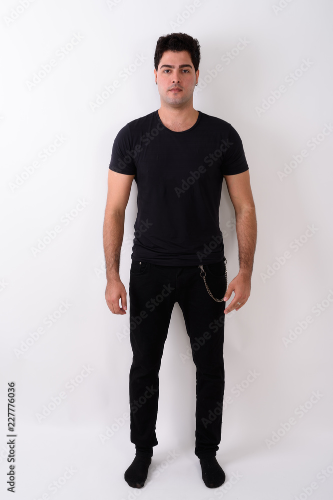 Young handsome Persian man against white background Young handsome Persian man against white background