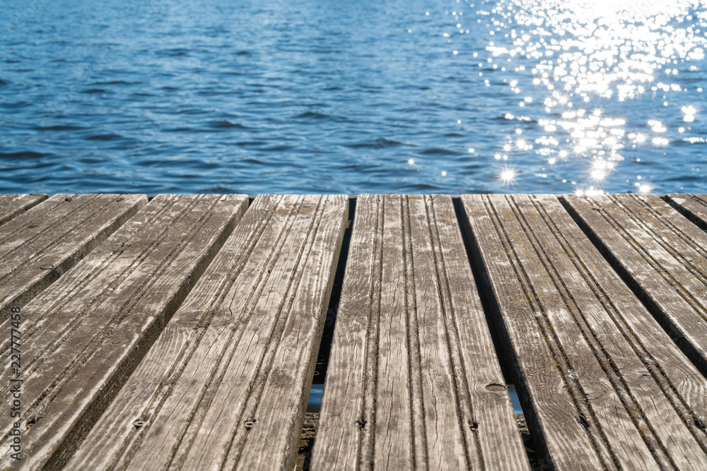 Empty wooden platform with sea background Empty wooden platform with sea background