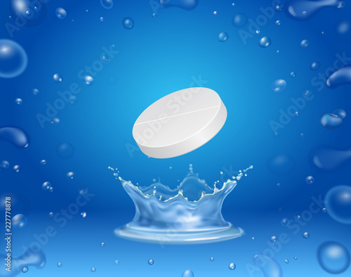 Tablet pill in the water with splash