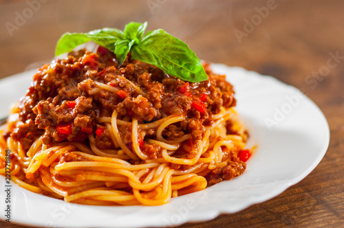 Obraz na plátně Traditional pasta spaghetti bolognese in white plate on wooden table background