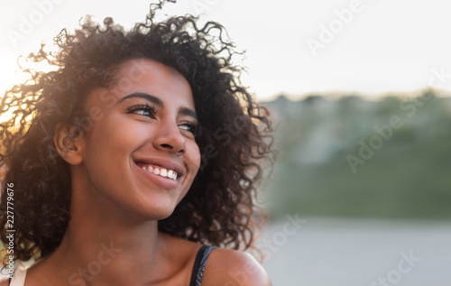 Outdoor portrait of smiling african american girl photo