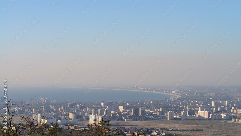 view from the mountain to the city located on the coast of the black sea
