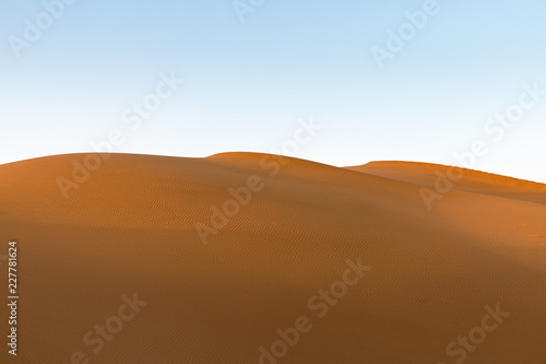 golden sand dunes in sunset