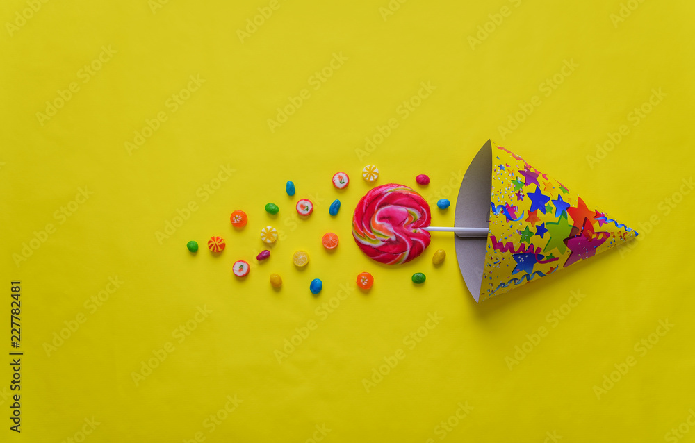 Candy caramel on a yellow background. Celebration. Candy caramel on a yellow background. Celebration.