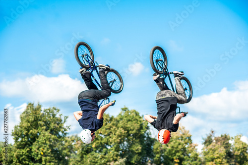 Photos Boy jumping with his bmx in the park