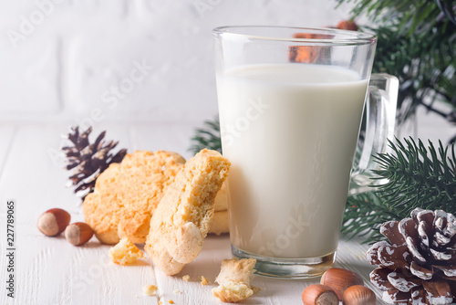 Cookies and milk for Santa Clause on wood background, photo