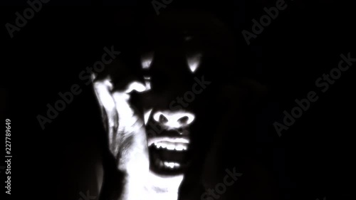 Horror scene screaming man face. Scary evil many faces.