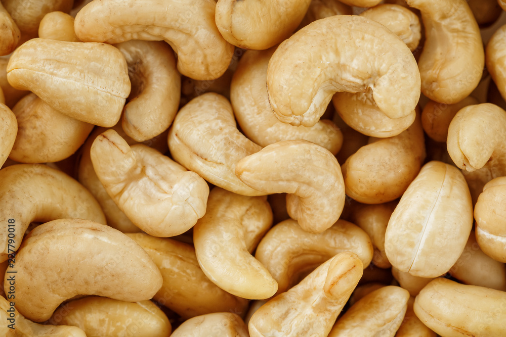 Cashew with no shell on a background. Macro nuts, Organic vegan food. Cashew with no shell on a background. Macro nuts, Organic vegan food.