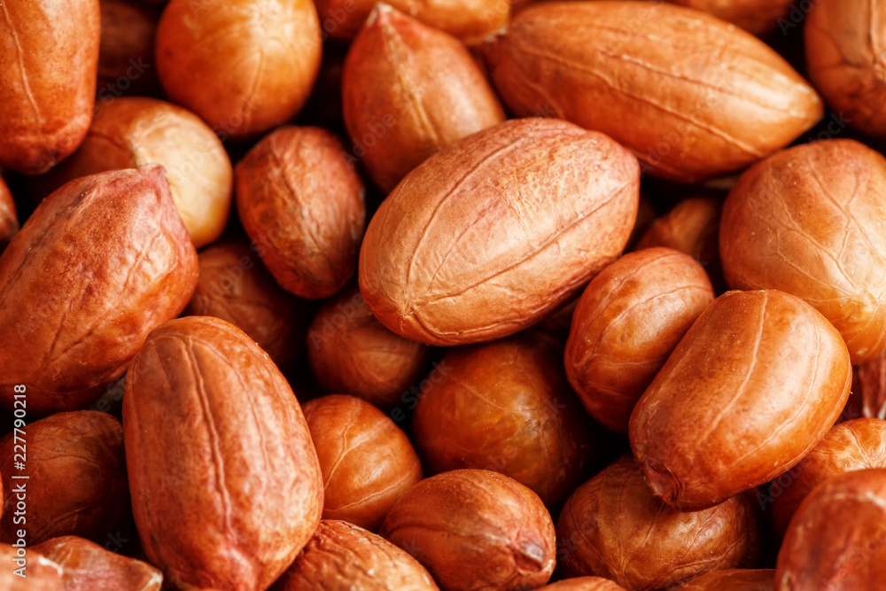 Peanuts, for background or textures. Uncleaned inshell peanuts. Peanuts, for background or textures. Uncleaned inshell peanuts.