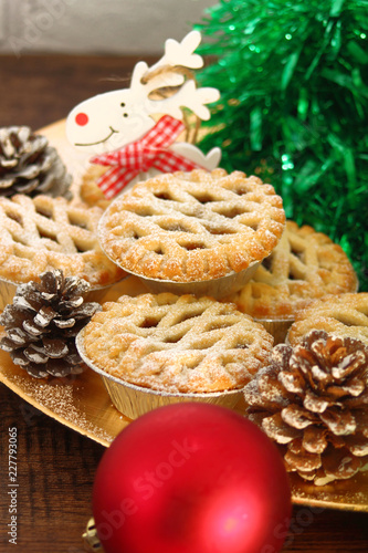 Christmas mince pies on a wooden background
