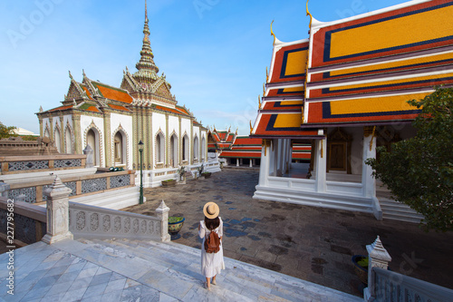 Woman tourist is enjoy traveling inside Wat Phra Keaw in Bangkok, Thailand. photo