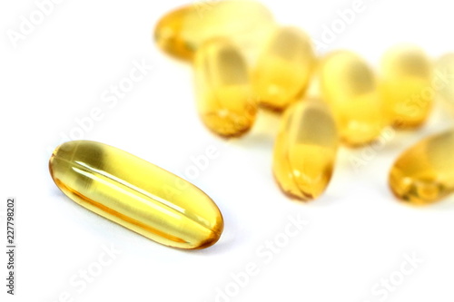 Close up yellow Cod Liver Oil capsule on white background, fish oil is a dietary supplement derived from liver of cod fish, have omega-3 fatty acids, EPA, DHA, vitamin A and D