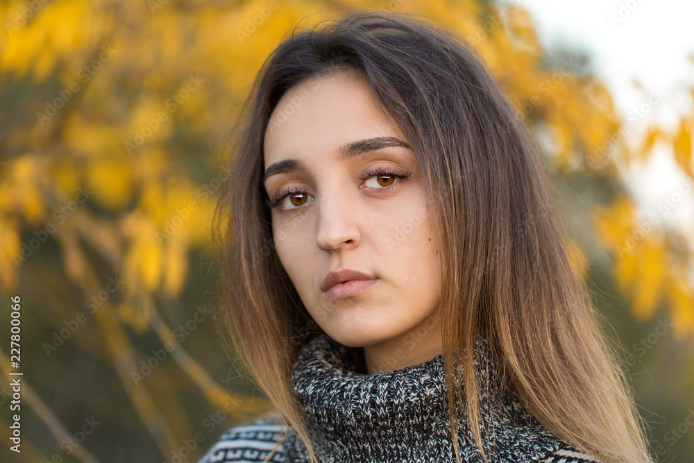 Autumn portrait of a girl in ethnic sweater Autumn portrait of a girl in ethnic sweater
