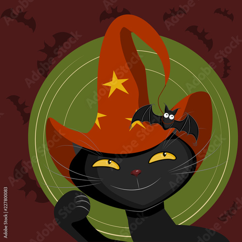 black cat in a witch hat catches a bat