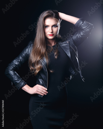 portrait of young woman. studio photography. Lady in black. portrait on black background. Red lipstick. Low key. 