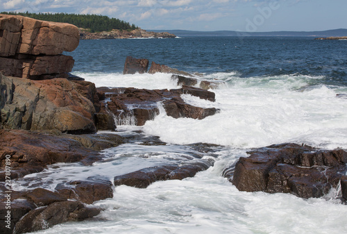 Waves hitting Granite rock in the shore of Acadia National Park, USA