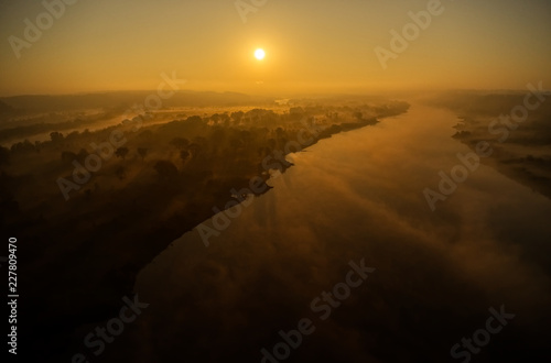 Sunrise above the wild meadows and river