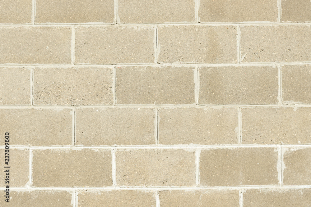 Fototapeta premium Block brick wall background texture. Brick fence.