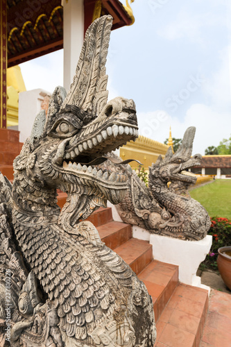Close-up of an ornate dragon statue at the Pha That Luang  Great Stupa  in Vientiane  Laos.