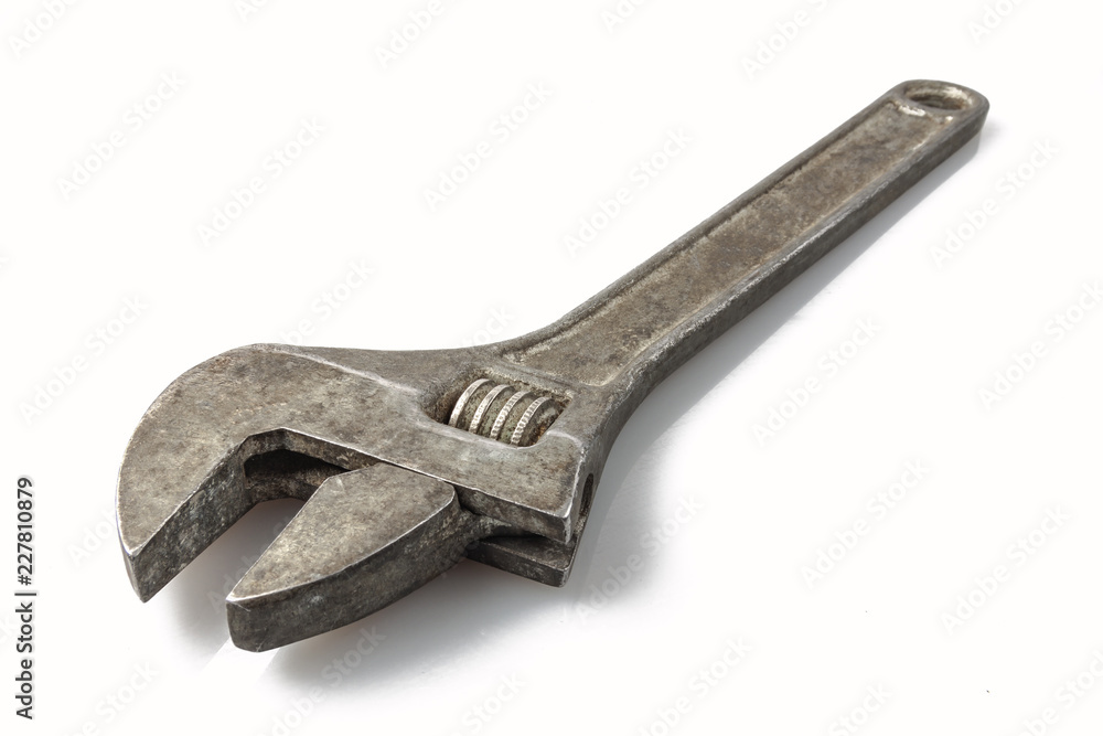 Tool: old adjustable wrench on a white background, isolate Tool: old adjustable wrench on a white background, isolate