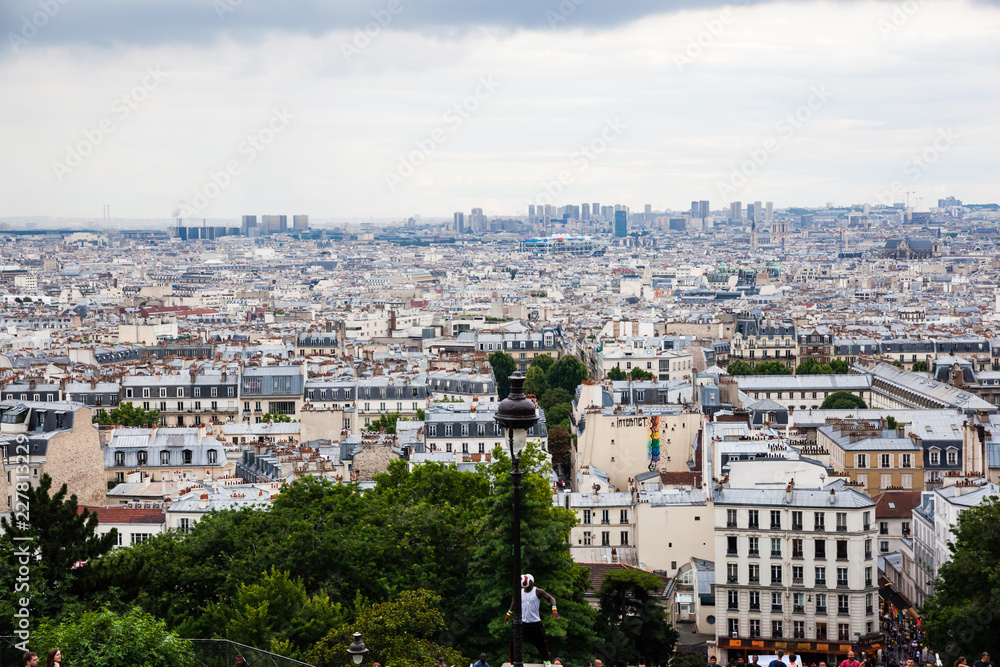 The view from Basilica of the Sacred Heart of Paris with tourists around,