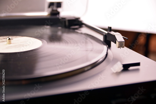 Turntable vinyl record player is playing music