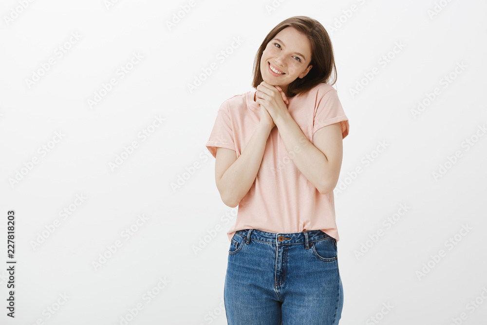 You are so cute I am touched. Portrait of pleased charming woman in trendy t-shirt, tilting head and smiling broadly, clenching hands together while being moved with pleasant surprise You are so cute I am touched. Portrait of pleased charming woman in trendy t-shirt, tilting head and smiling broadly, clenching hands together while being moved with pleasant surprise