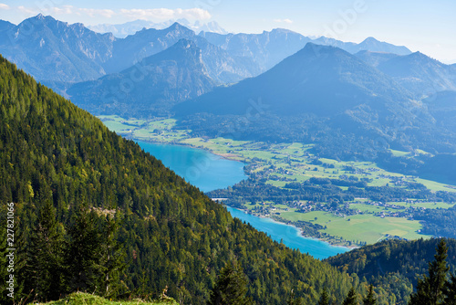 Mountain landscape with forest, lake and blue sky in Austrian Alps. Salzkammergut region