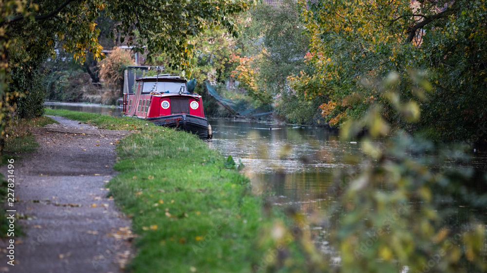 Autumnal landscape with an old boat
