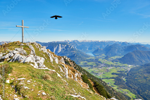 A cross from the top of the mountain Hoher Sarstein. Beautiful landscape. Salzkammergut region, Bad Goisern, Austria.