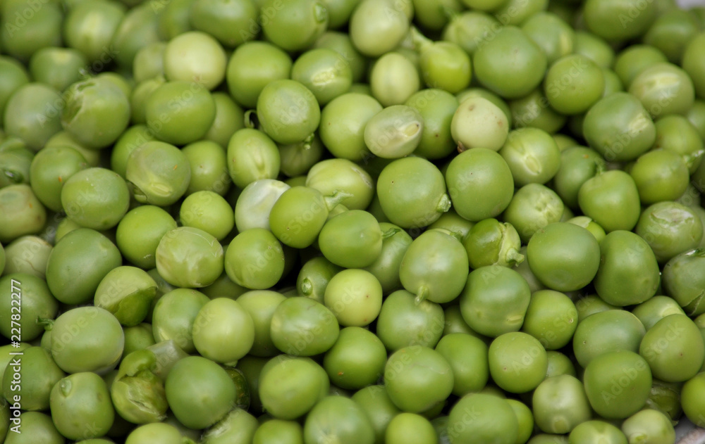 A grain of peeled young green peas A grain of peeled young green peas