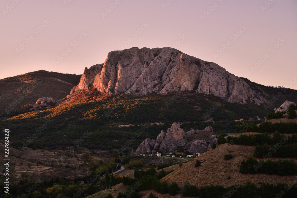 Fototapeta premium Mountain in the rays of sunset