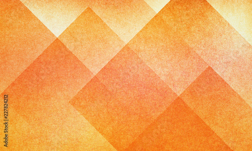 orange abstract background with autumn colors of red and yellow textured design for thanksgiving halloween and fall, geometric block pattern